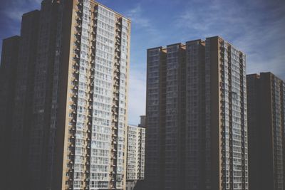 Low angle view of skyscrapers against sky