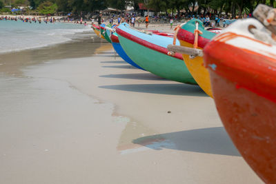Boats moored on shore at beach