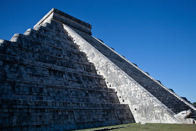 Low angle view of built structure against clear blue sky