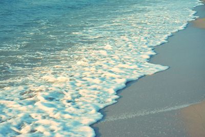 Close-up of surf on beach