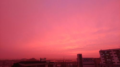 Buildings against sky during sunset