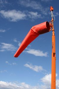 Low angle view of flag against sky