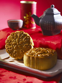 Close-up of sweet food with tea on table