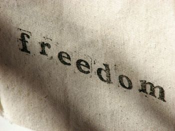 Close-up of text on sand