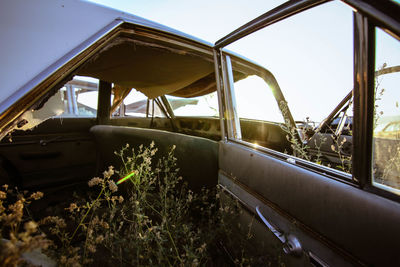 Close-up of car against sky