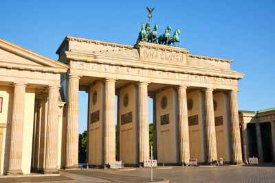 The iconic brandenburg gate in berlin on a sunny day