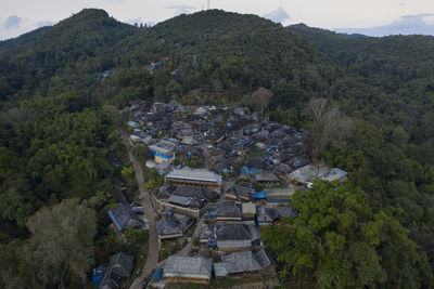 High angle view of townscape and mountains
