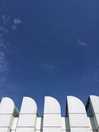 Low angle view of building against blue sky