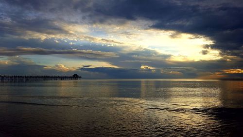 Scenic view of sea against sky at sunset