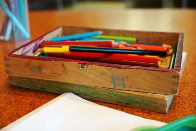 Close-up of multi colored pencils on table