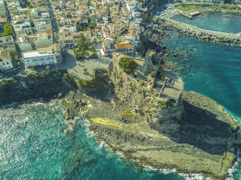 High angle view of cityscape by sea