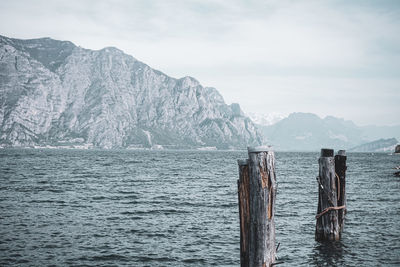 Scenic view of sea and mountains against sky