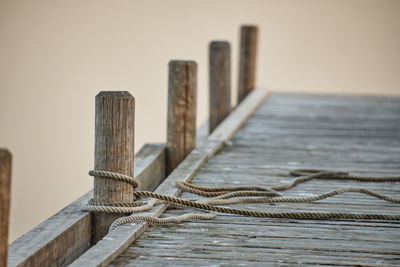 Close-up of rope tide on wooden pier