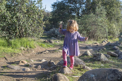 Girl walking on rocks