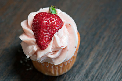 Close-up of strawberry on cupcake