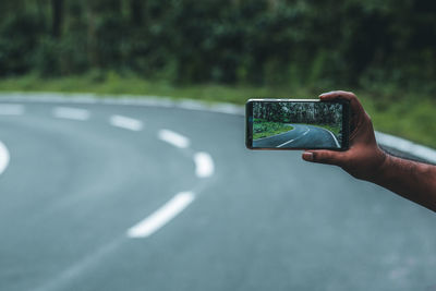 Close-up of person photographing on smart phone 