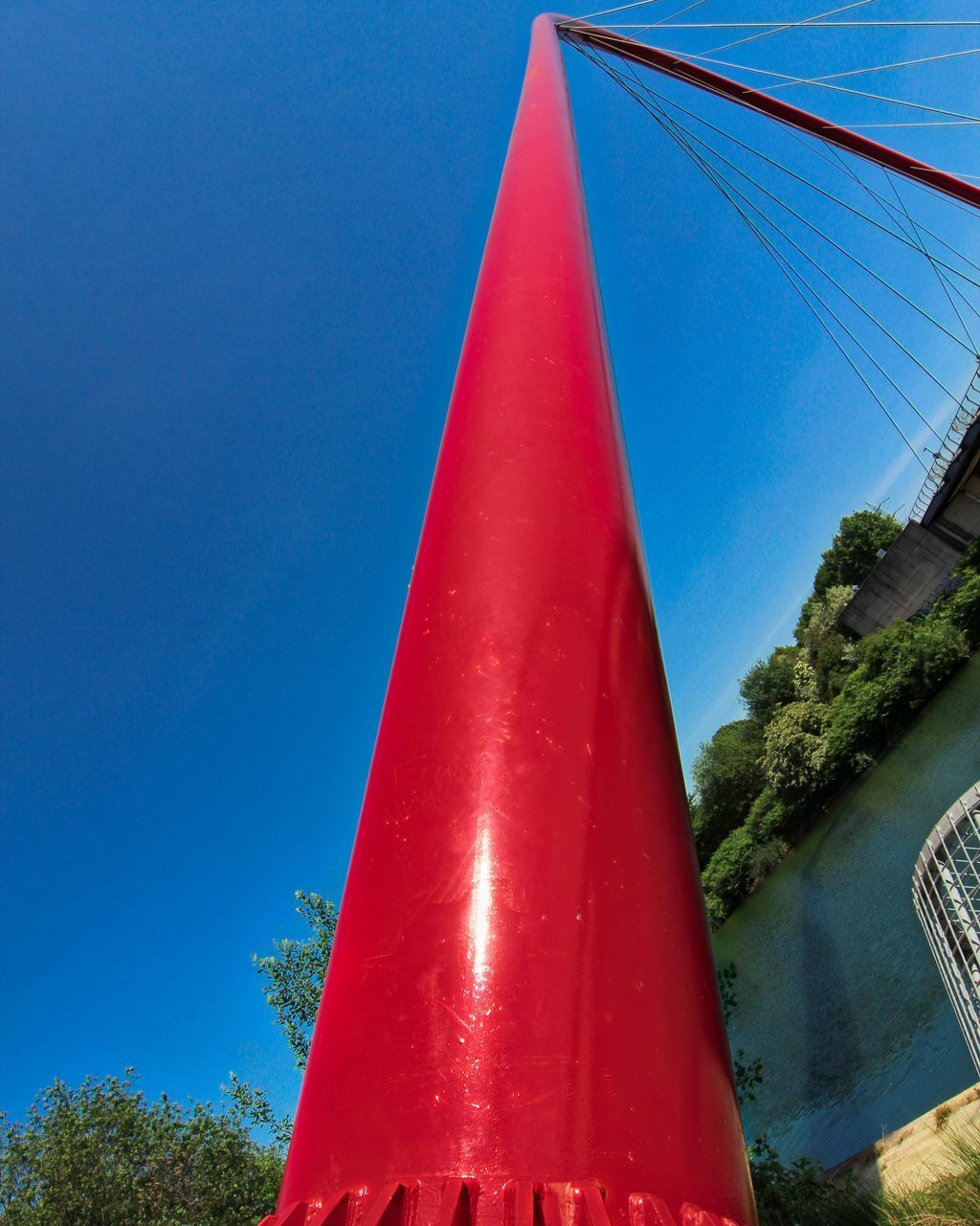 LOW ANGLE VIEW OF POLE AGAINST BLUE SKY