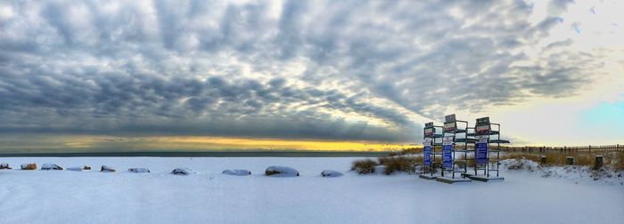 Scenic view of frozen lake against sky during winter