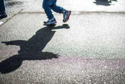 Shadow of a child on street