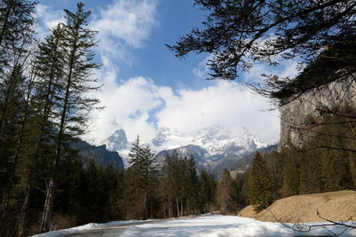 Scenic view of snow covered mountains against sky