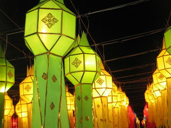 Low angle view of illuminated lanterns hanging on ceiling