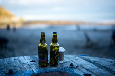 Close-up of wine bottles on table