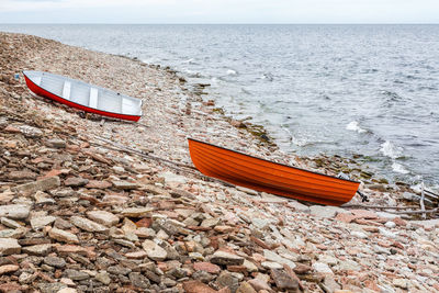 Boat moored on beach