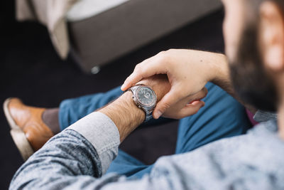 Cropped hand of man using mobile phone