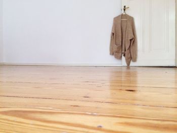 Clothes hanging on hardwood floor