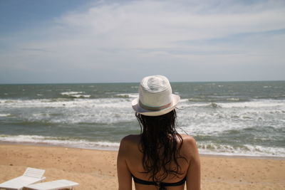 Rear view of woman on beach