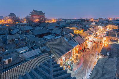 High angle view of illuminated buildings in city