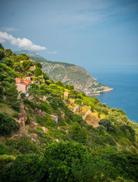 Scenic view of sea and buildings against sky