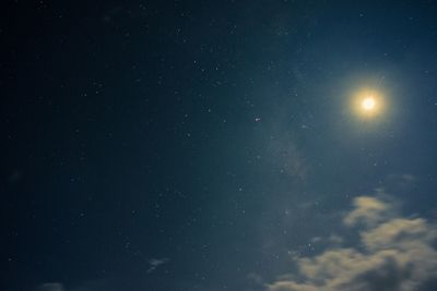 Low angle view of moon against sky at night