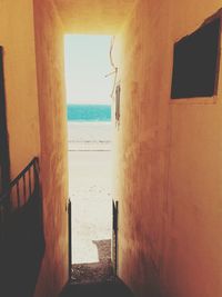 View of sea through window