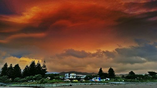 View of road against cloudy sky at sunset