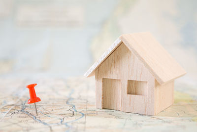 Close-up of small toy on house