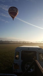 Hot air balloon flying over land