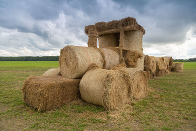 Tractor from straw bales in the field