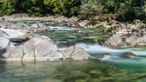 Boulders and rocks on the riverbed of the torre river. friuli to discover