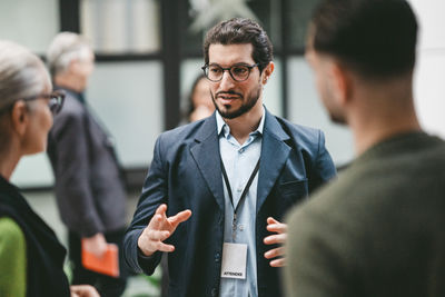 Portrait of businessman using mobile phone