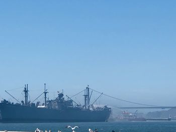 Commercial dock against clear blue sky