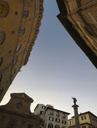 Low angle view of buildings against clear sky