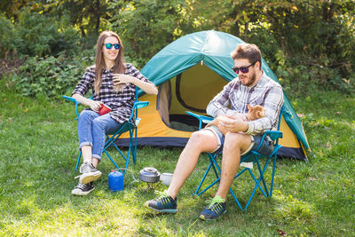 Men sitting in tent