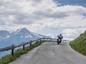 Scenic view of landscape against cloudy sky