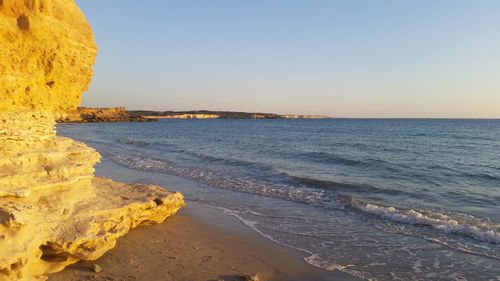 Scenic view of sea at sunset