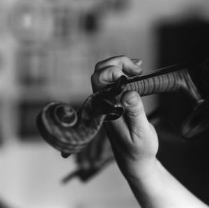 Close-up of hand playing violin