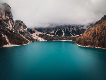 Scenic view of lake and mountains against sky