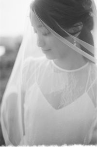 Portrait of young woman looking down