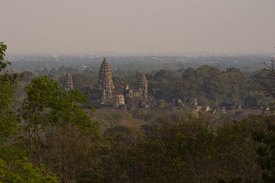 Panoramic view of temple and buildings against sky