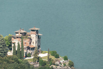 View of buildings and sea against sky